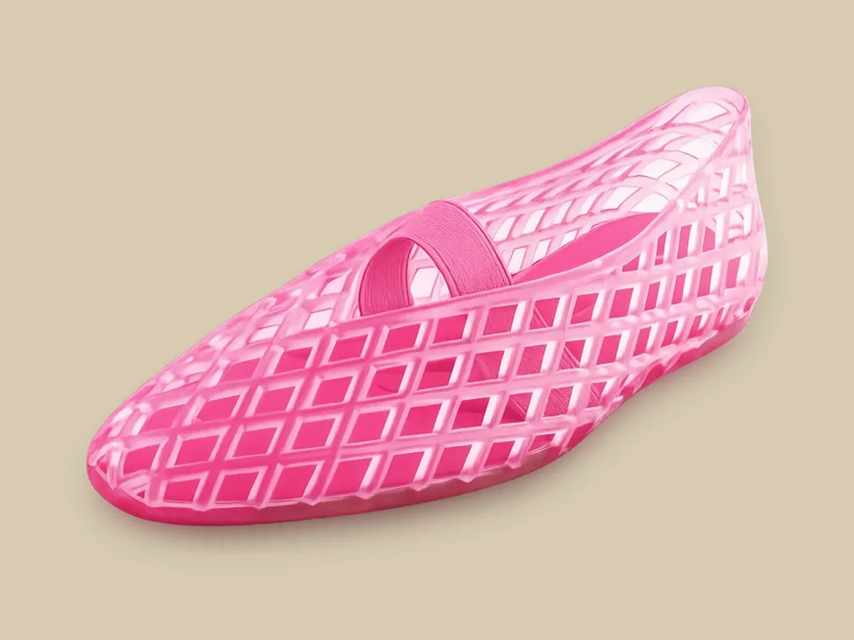 Pink woven jelly flat with an elastic strap