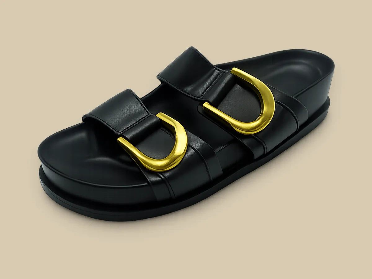 Black leather two-strap slide with gold buckles